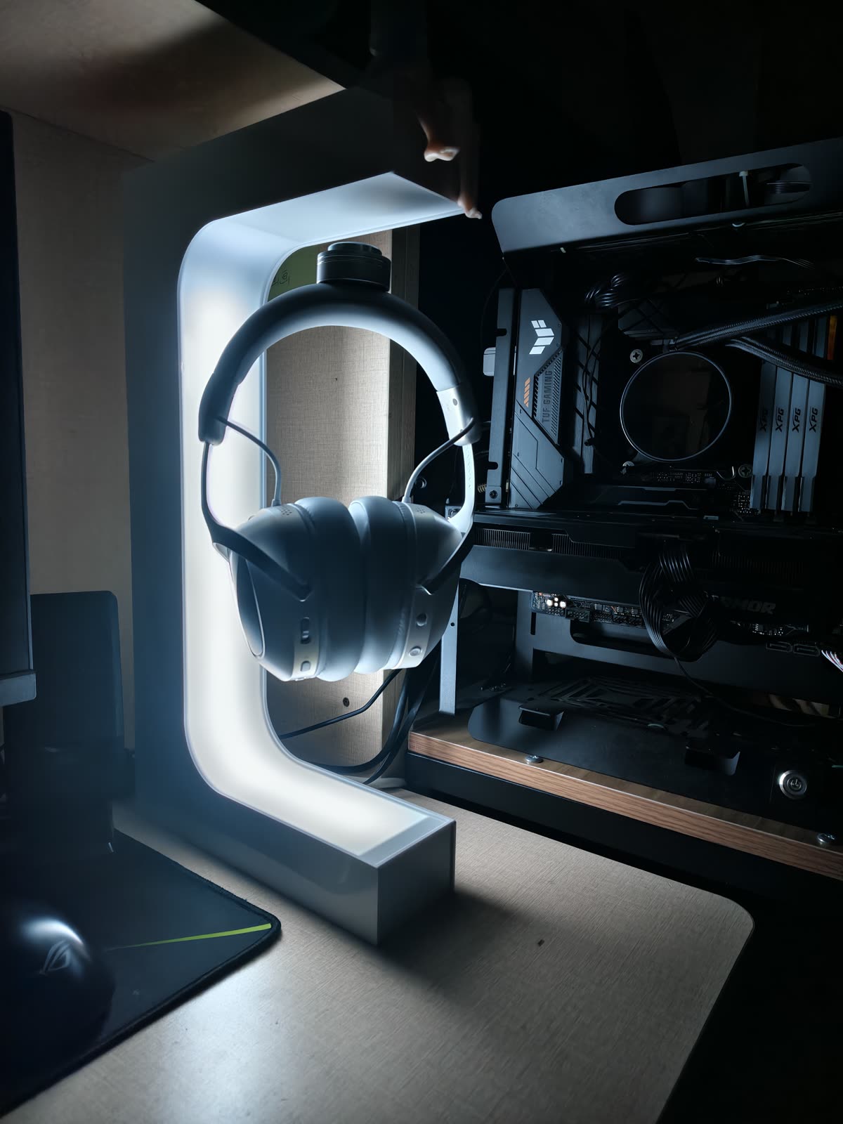 Beacon 01 glowing close to a headset in a real desk setup