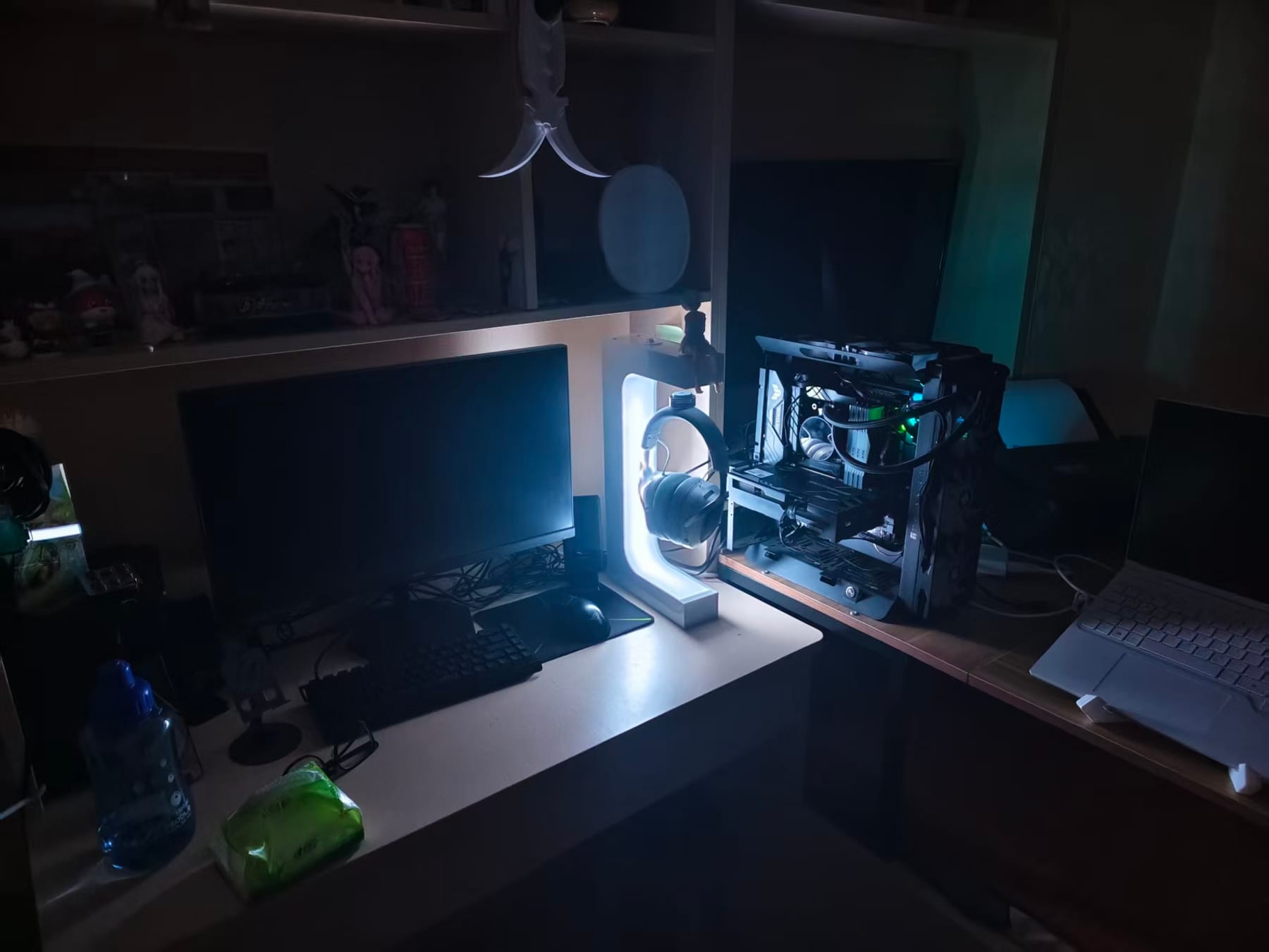 Beacon 01 glowing in a real desktop setup beside a PC